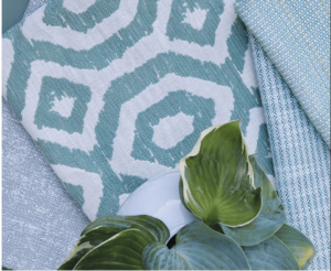 Teal color fabric with a plant