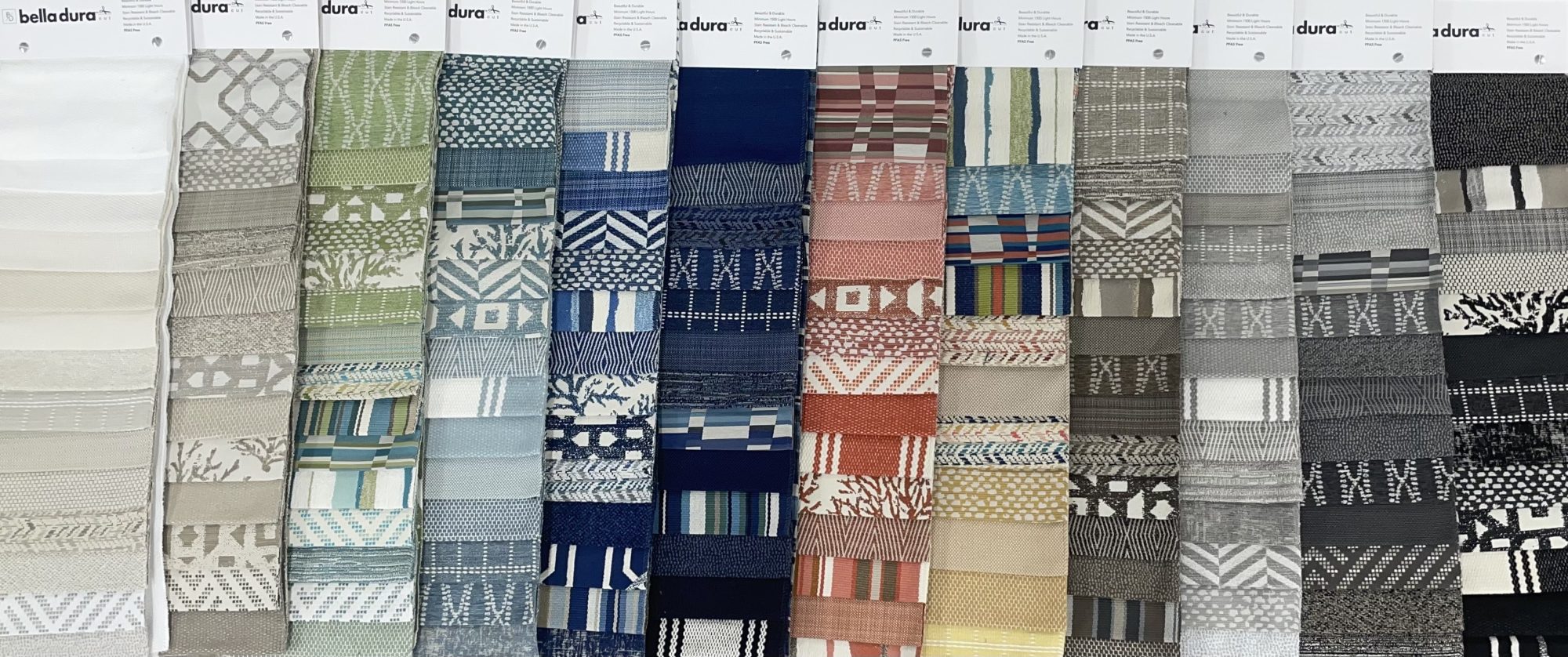 Samples of many of the Bella Dura fabric colors and designed, organized by color.