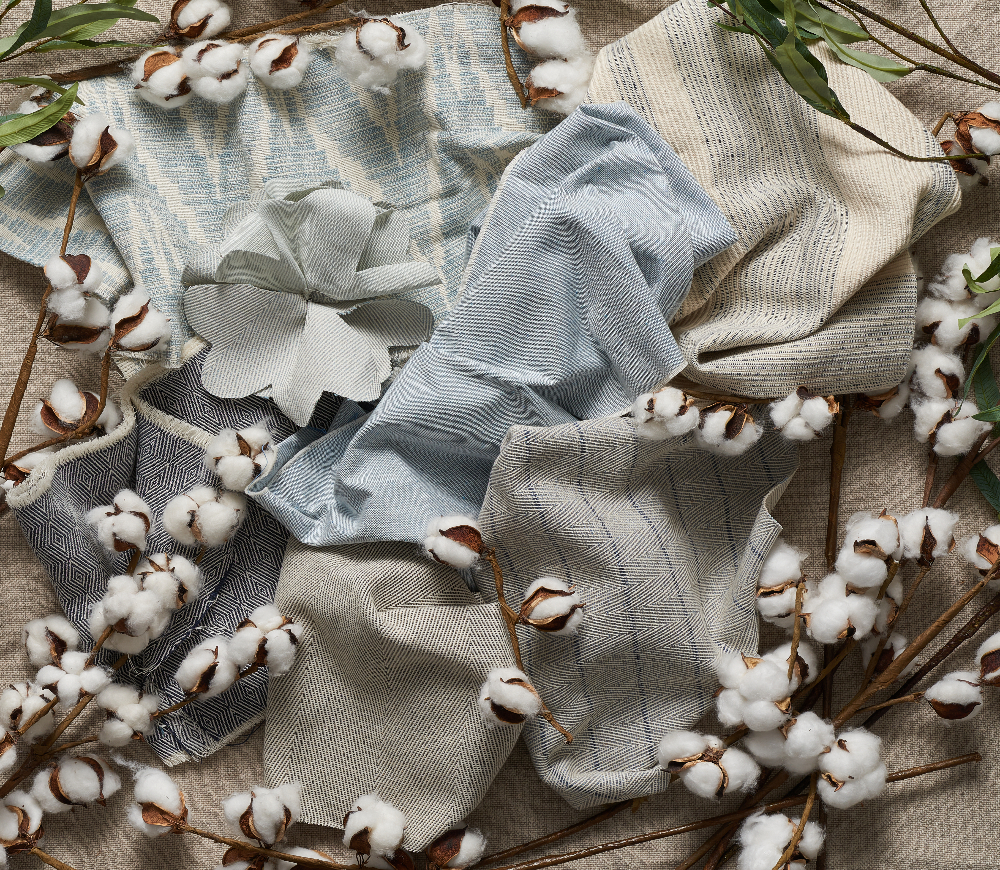 variety of blue swavelle fabrics and cotton plants